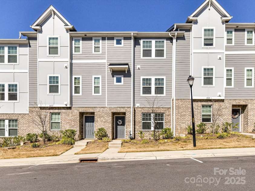 2610 Greenmarket Drive, Charlotte, NC 28217.  MLS# CAR4233387, YatesRealty ID 14864. Not only is there an attached 2-car side by side garage, there is lots of guest parking spots located right in front of the townhome!