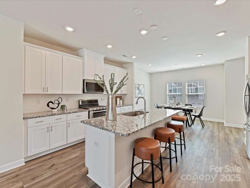 2610 Greenmarket Drive, Charlotte, NC 28217.  MLS# CAR4233387, YatesRealty ID 14864. Upper Level Kitchen features a kitchen island, upgraded ss appliances, soft close cabinets and a pantry!