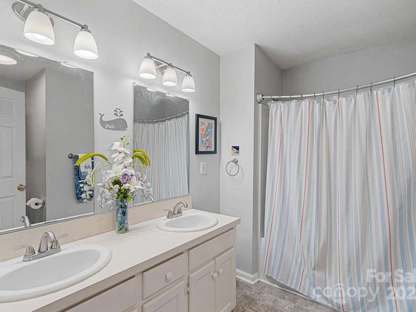 1665 Sherwood Court, Sherrills Ford, NC 28673.  MLS# CAR4223633, YatesRealty ID 14866. Full Bathroom upstairs has dual vanity and a tub/shower combo