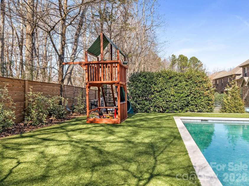 5422 Open Book Lane, Charlotte, NC 28270.  MLS# CAR4352219, YatesRealty ID 14880. LANDSCAPED WITH ARTIFICIAL TURF