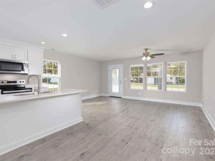 2014 Crown Point Drive, Albemarle, NC 28001.  MLS# CAR4195914, YatesRealty ID 14881. Lots of windows floods the space with natural light