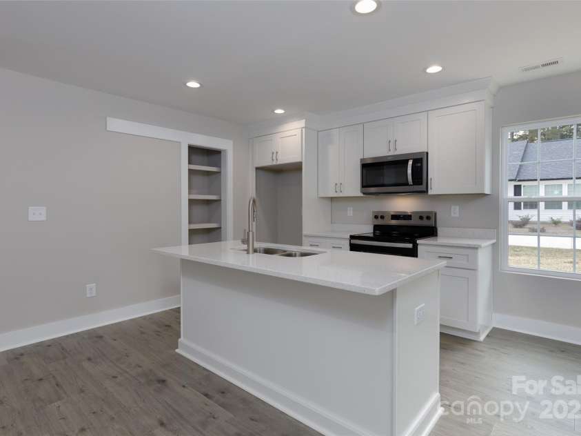 2014 Crown Point Drive, Albemarle, NC 28001.  MLS# CAR4195914, YatesRealty ID 14881. Lovely LVP flooring throughout the bottom floor