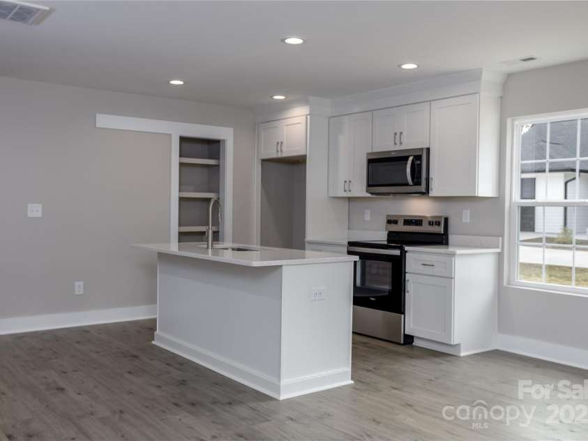 2014 Crown Point Drive, Albemarle, NC 28001.  MLS# CAR4195914, YatesRealty ID 14881. You will enjoy cooking in this kitchen with pantry