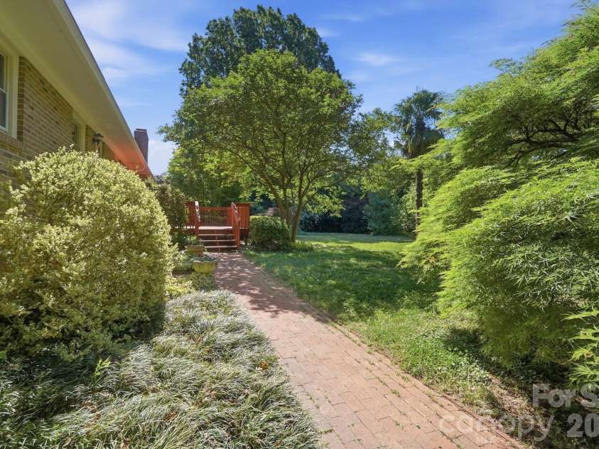 2814 Williams Road, Matthews, NC 28105.  MLS# CAR4372223, YatesRealty ID 14882. Brick path leading to the back door and Deck