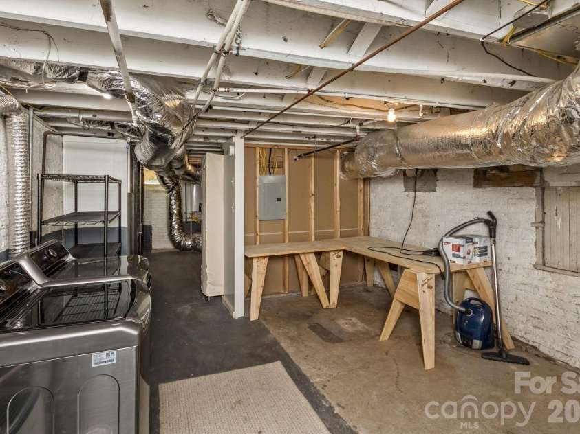 180 Tacoma Circle, Asheville, NC 28801.  MLS# CAR4370430, YatesRealty ID 14884. Basement level laundry and storage 