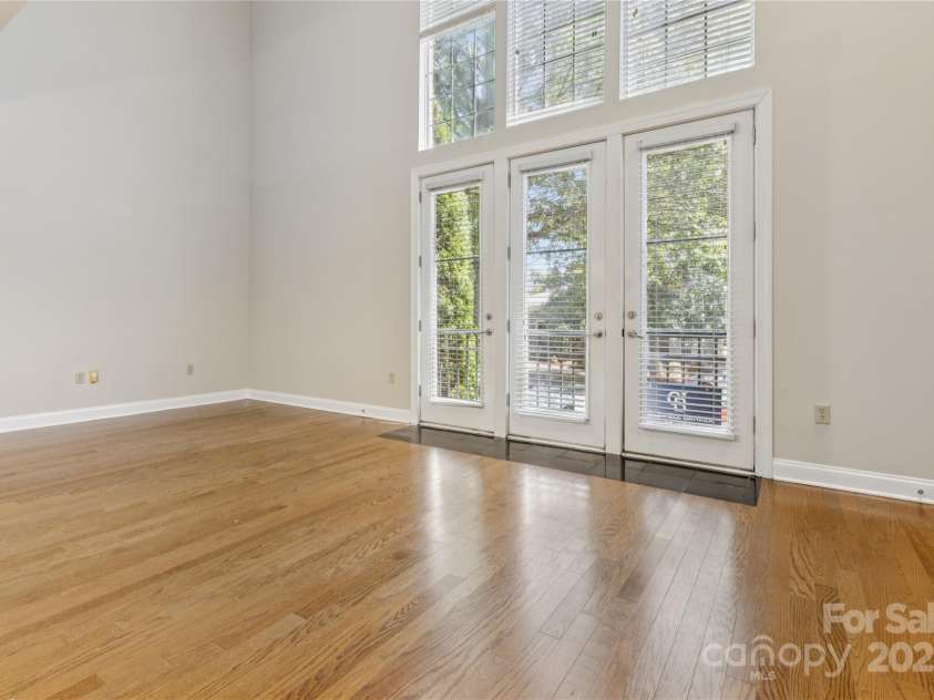 120F Steinbeck Way, Mooresville, NC 28117.  MLS# CAR4258750, YatesRealty ID 14892. Great room featuring a wall of windows