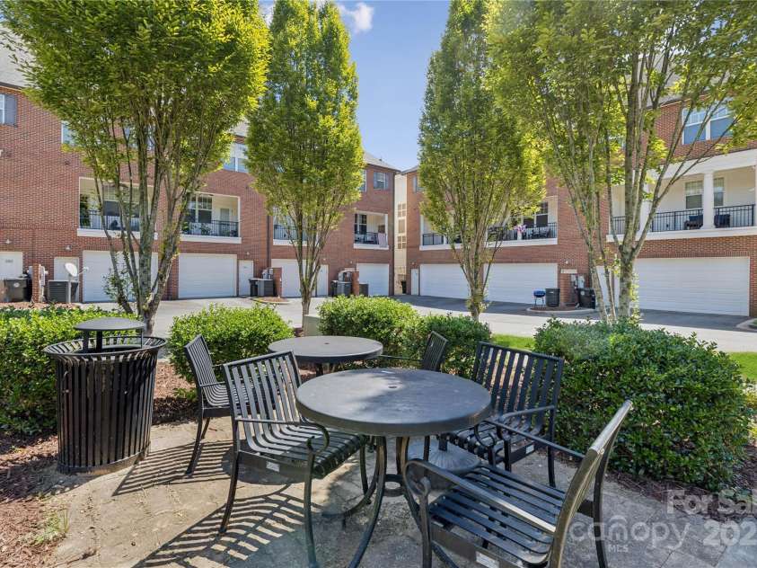 120F Steinbeck Way, Mooresville, NC 28117.  MLS# CAR4258750, YatesRealty ID 14892. One of several tables/chairs at the community park.