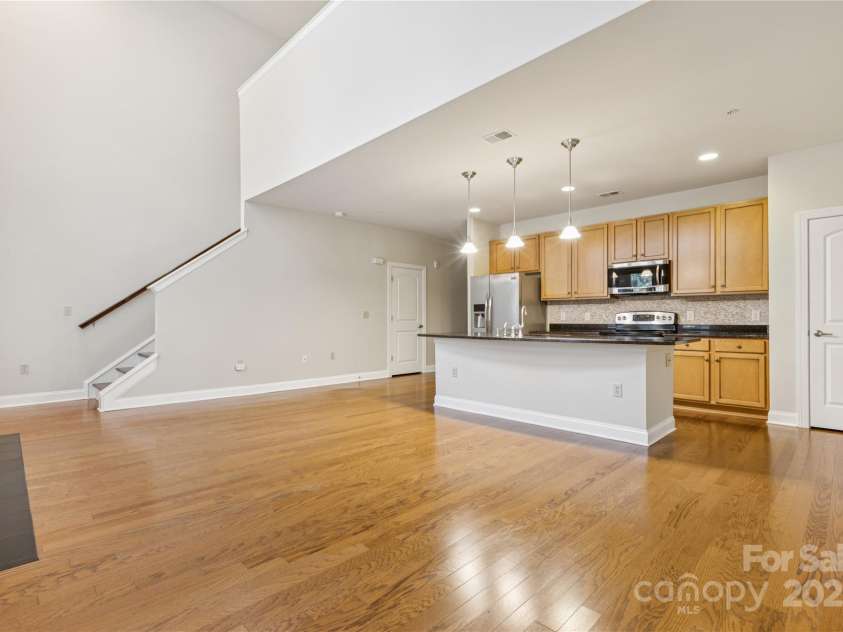 120F Steinbeck Way, Mooresville, NC 28117.  MLS# CAR4258750, YatesRealty ID 14892. View to the stairs leading to the loft bedroom