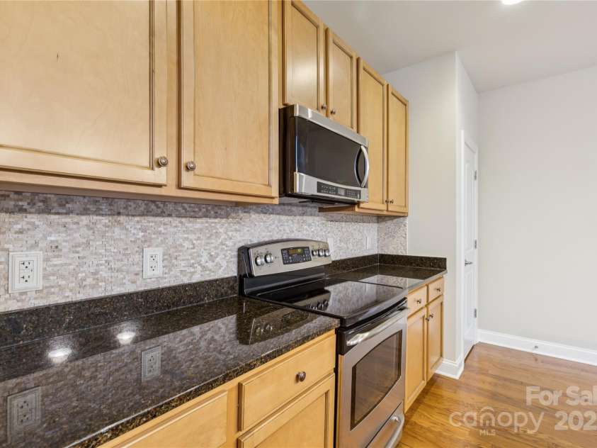120F Steinbeck Way, Mooresville, NC 28117.  MLS# CAR4258750, YatesRealty ID 14892. Wood cabinets and granite counters