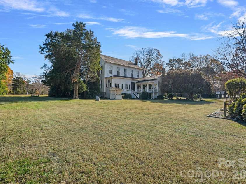 104 Leslie Loop, Mooresville, NC 28115.  MLS# CAR4195674, YatesRealty ID 149. Expansive property with fruit and nut trees!