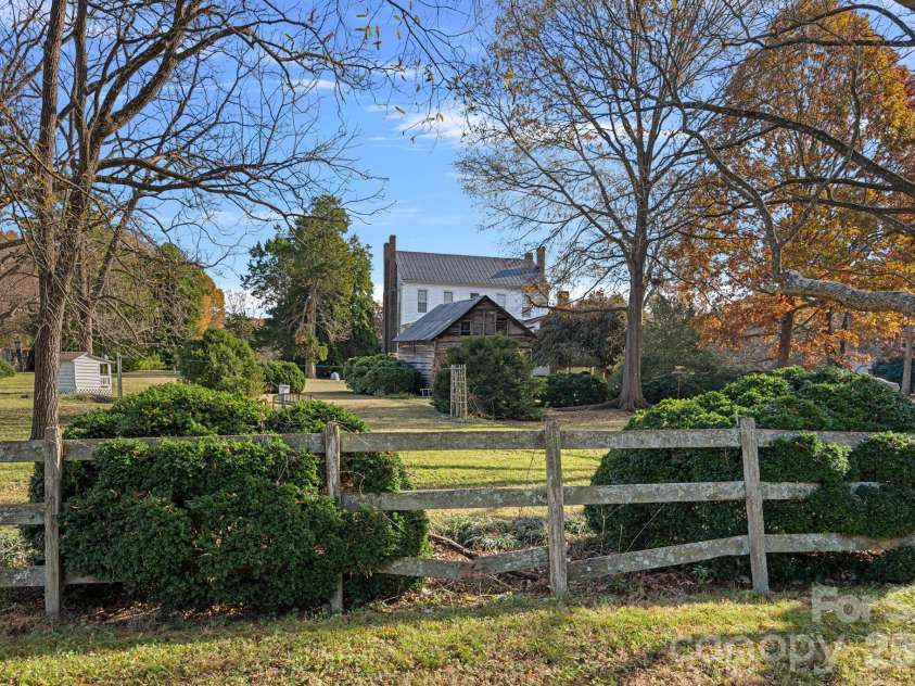 104 Leslie Loop, Mooresville, NC 28115.  MLS# CAR4195674, YatesRealty ID 149. From beyond the fence...