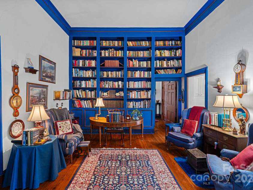 104 Leslie Loop, Mooresville, NC 28115.  MLS# CAR4195674, YatesRealty ID 149. Study with built-in bookshelves in period colors.