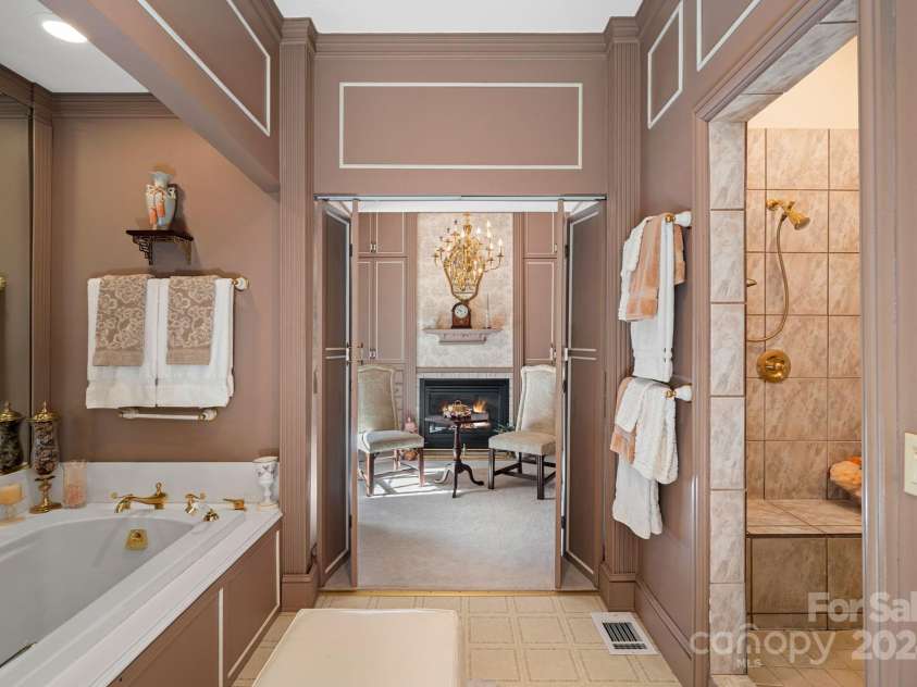 104 Leslie Loop, Mooresville, NC 28115.  MLS# CAR4195674, YatesRealty ID 149. The home's only Bathroom is on the first floor. It is located in the rear of the home in a wing that was added around 1850. Jetted soaking tub, tiled Grecian shower, water closet and private dressing room w/fireplace!