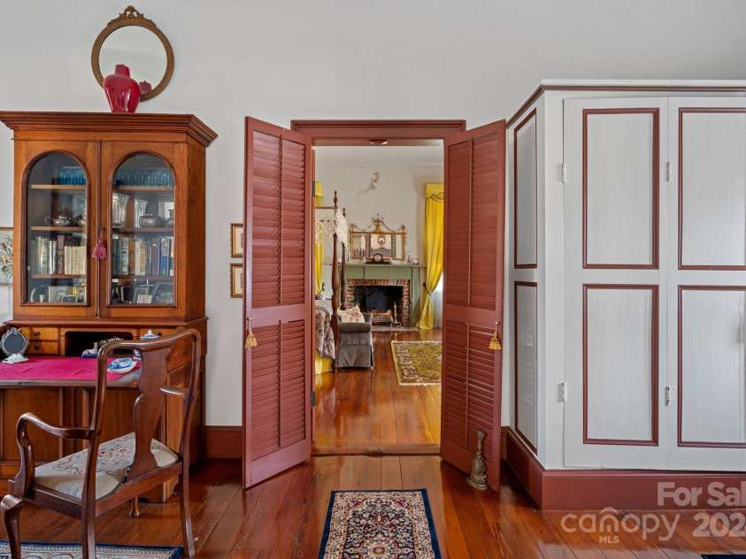 104 Leslie Loop, Mooresville, NC 28115.  MLS# CAR4195674, YatesRealty ID 149. Upstairs Hall. Original wood shutters into the largest of the 4 Bedrooms