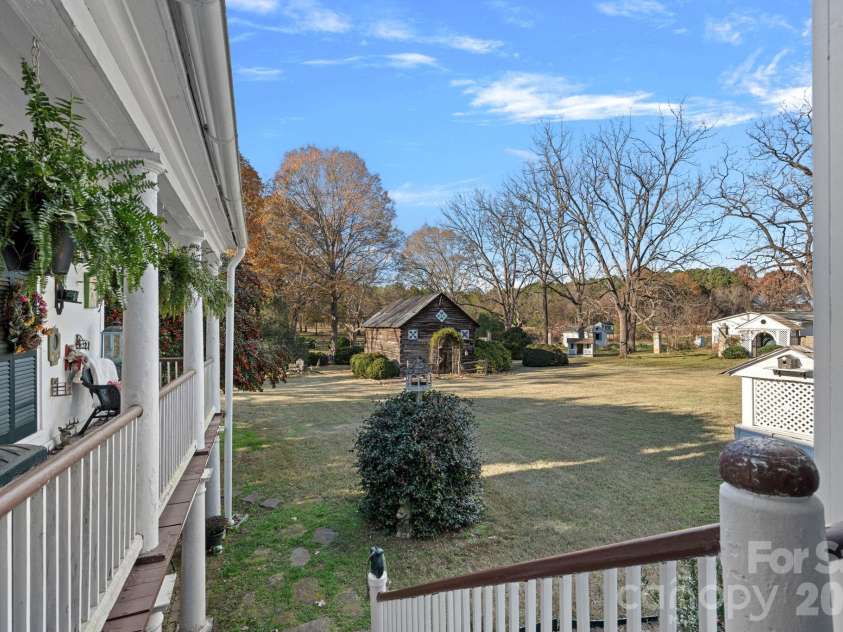 104 Leslie Loop, Mooresville, NC 28115.  MLS# CAR4195674, YatesRealty ID 149. View into the backyard from the back porch