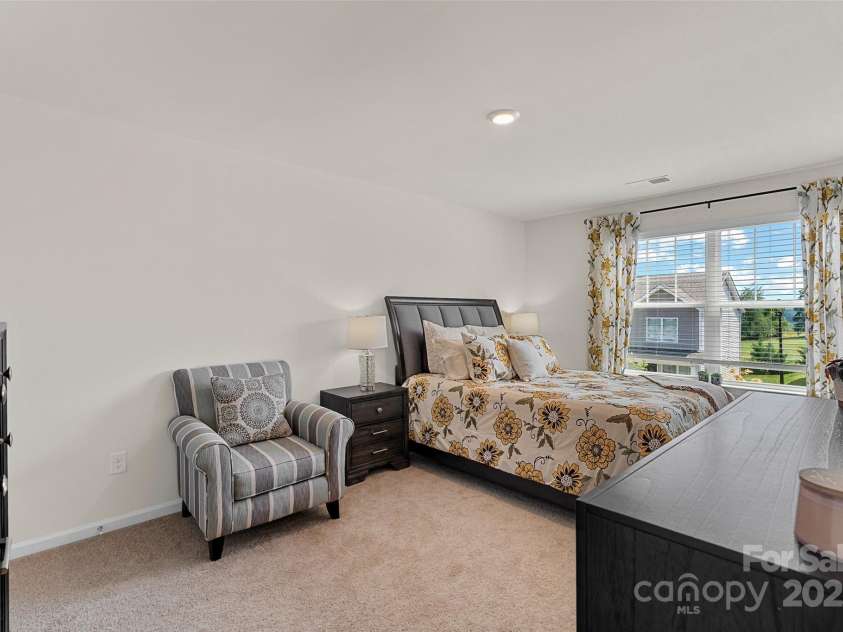 64 Benedict Lane, Weaverville, NC 28787.  MLS# CAR4208936, YatesRealty ID 1490. 1 of 2 upper level guest bedrooms