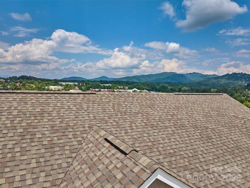 64 Benedict Lane, Weaverville, NC 28787.  MLS# CAR4208936, YatesRealty ID 1490. Check out the year round views to the rear