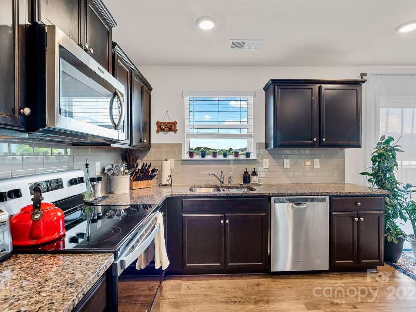 64 Benedict Lane, Weaverville, NC 28787.  MLS# CAR4208936, YatesRealty ID 1490. Full appliance package included with views from kitchen window