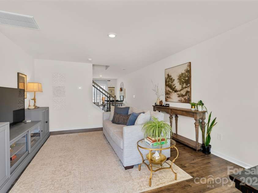 64 Benedict Lane, Weaverville, NC 28787.  MLS# CAR4208936, YatesRealty ID 1490. Living room opens to kitchen/dining areas