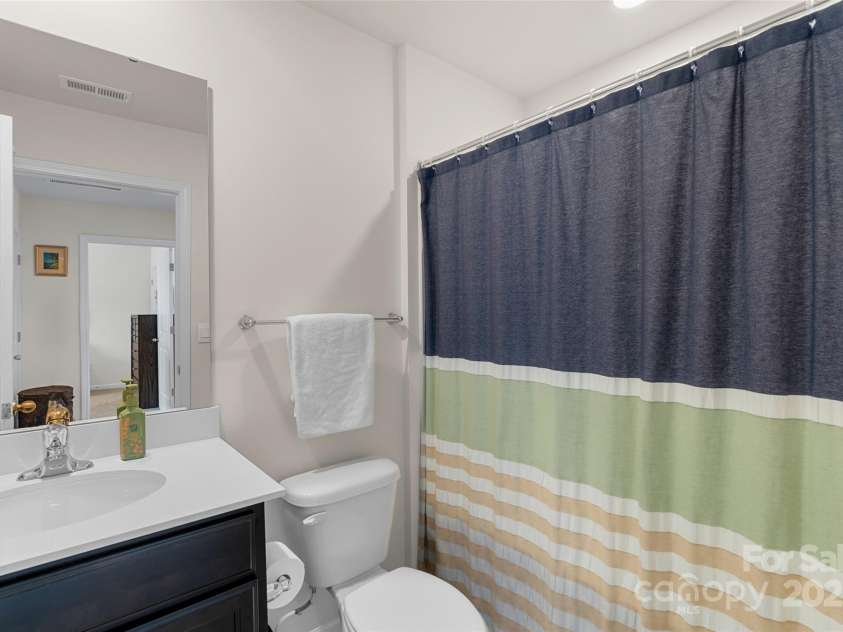 64 Benedict Lane, Weaverville, NC 28787.  MLS# CAR4208936, YatesRealty ID 1490. Upper level guest full bath with tub/shower combo