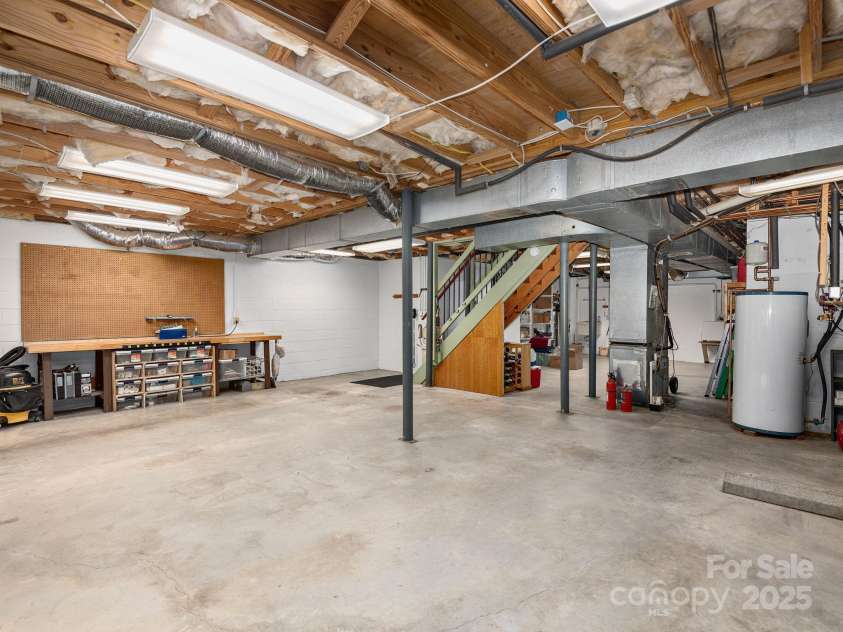 308 Sondley Drive, Asheville, NC 28805.  MLS# CAR4202100, YatesRealty ID 14904. Fully encapsulated crawlspace, can be converted back to two car garage, and lift to main level.