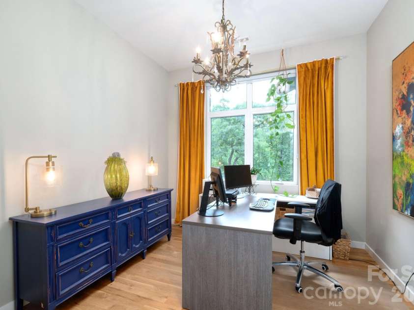 559 Shining Rock Path, Horse Shoe, NC 28742.  MLS# CAR4372540, YatesRealty ID 14910. Dedicated office with large window views, warm natural light, and space for working from home.