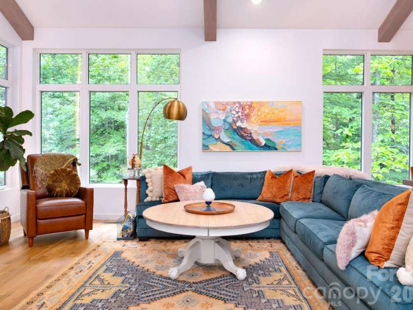 559 Shining Rock Path, Horse Shoe, NC 28742.  MLS# CAR4372540, YatesRealty ID 14910. Expansive windows with wooded views