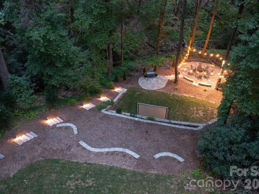 559 Shining Rock Path, Horse Shoe, NC 28742.  MLS# CAR4372540, YatesRealty ID 14910. Stone pathways to the fire pit lounge.