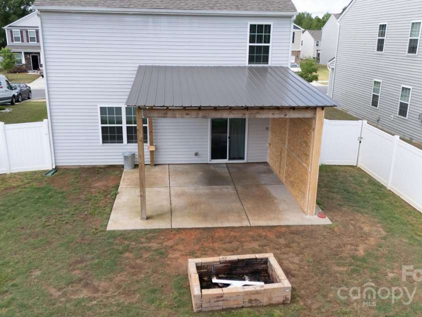 316 Gaines Road, Clover, SC 29710.  MLS# CAR4254643, YatesRealty ID 14912. Fire pit and fenced yard