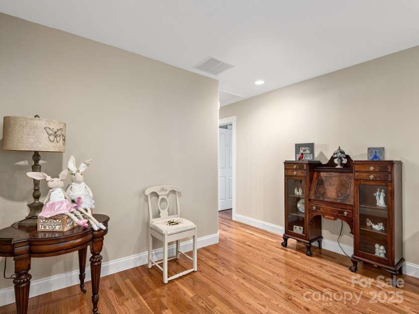 15 Bonnies Lane, Asheville, NC 28803.  MLS# CAR4252426, YatesRealty ID 14917. Upstairs landing looking down into the living room located just at the top of the stairs.