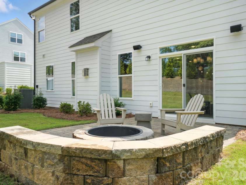 109 Summerhill Drive, Mooresville, NC 28115.  MLS# CAR4373648, YatesRealty ID 14922. Paver patio, firepit & seating wall
