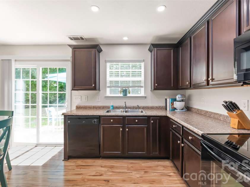 4166 Cordell Court, Midland, NC 28107.  MLS# CAR4373907, YatesRealty ID 14926. Sink Overlooking Backyard