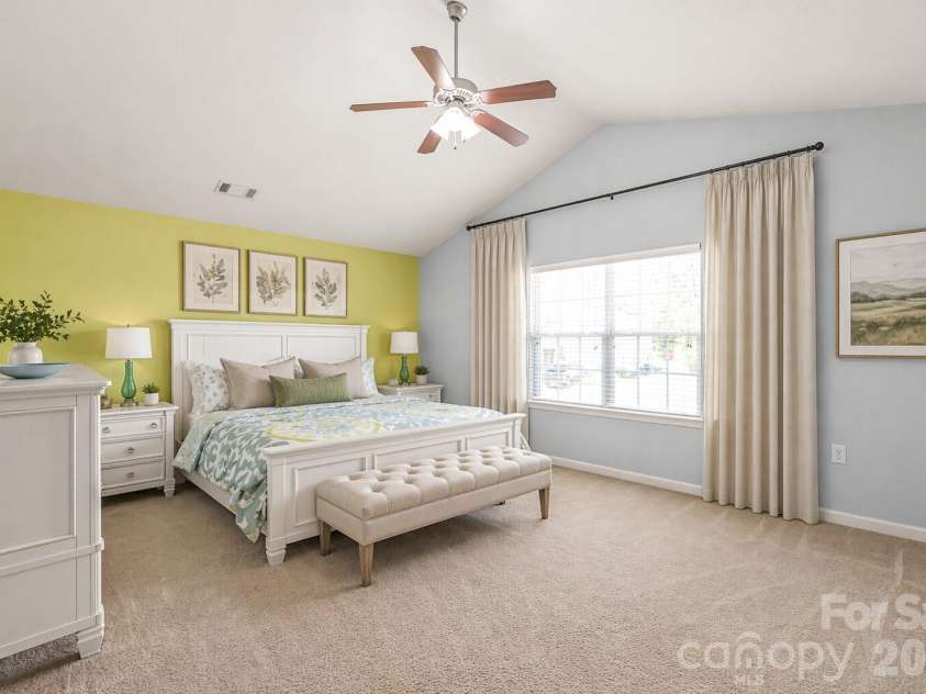 4166 Cordell Court, Midland, NC 28107.  MLS# CAR4373907, YatesRealty ID 14926. Stunning Primary Bedroom with Vaulted Ceilings - Decor has been virtually added