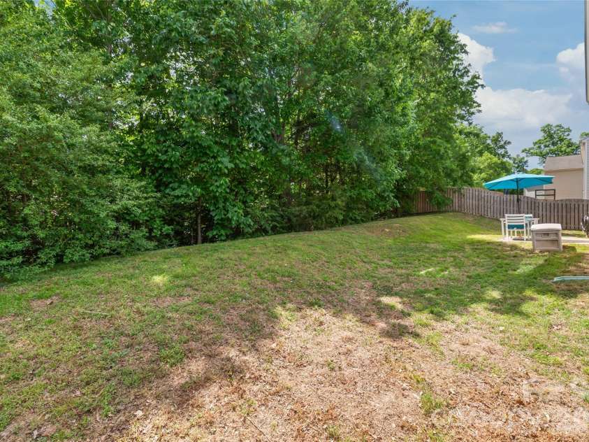 4166 Cordell Court, Midland, NC 28107.  MLS# CAR4373907, YatesRealty ID 14926. Treelined Backyard