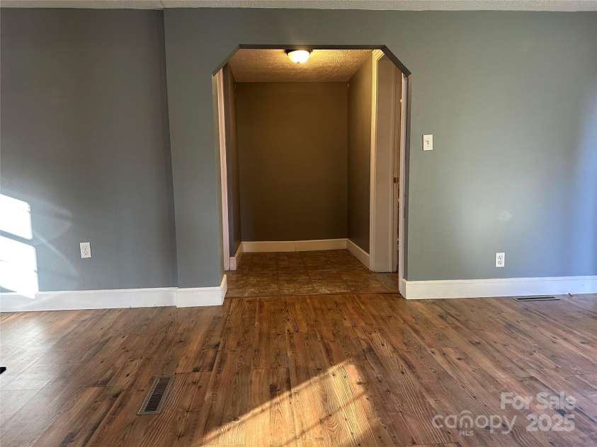 57 Eden Brook Drive, Canton, NC 28716.  MLS# CAR4247432, YatesRealty ID 14926. Living room to bedroom 1 and bathroom