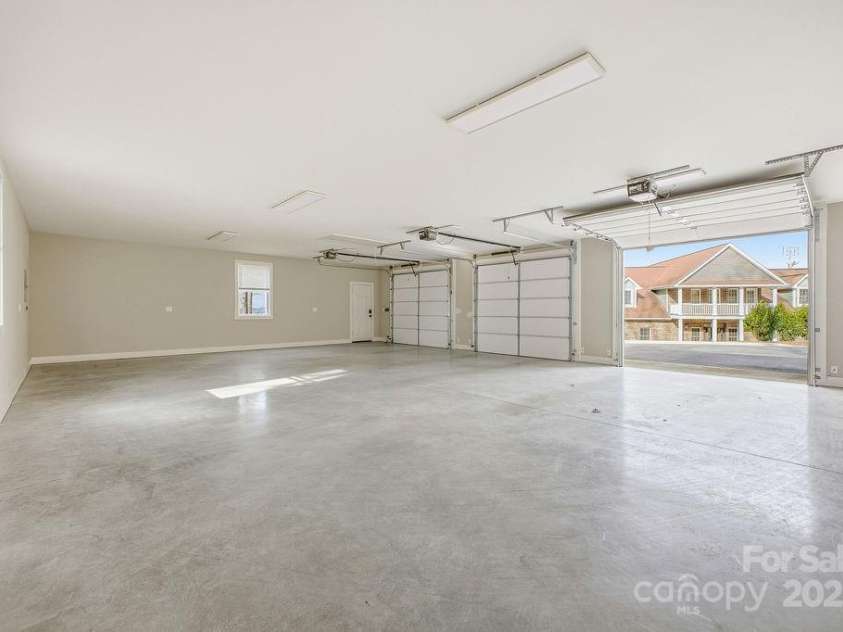 38 Sweetwater Oaks Drive, Fletcher, NC 28732.  MLS# CAR4331629, YatesRealty ID 1493. 3 car detached garage