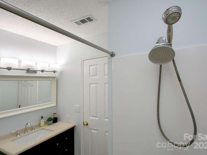 1610 Ford Street, Charlotte, NC 28216.  MLS# CAR4257993, YatesRealty ID 14930. Love that cool vanity and tub/shower unit.