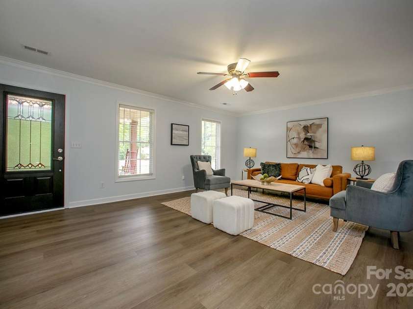 1610 Ford Street, Charlotte, NC 28216.  MLS# CAR4257993, YatesRealty ID 14930. The natural light just beams off the brand-new LVP flooring throughout.