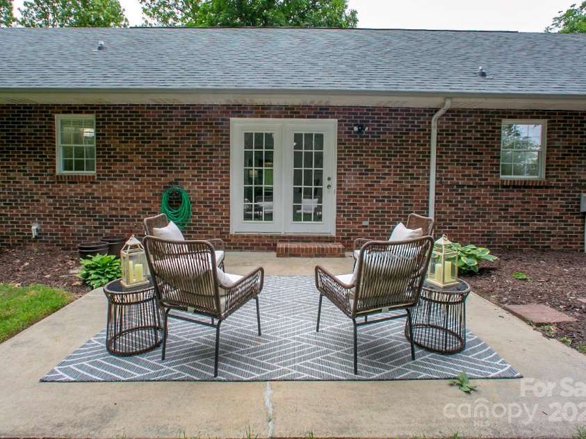 1610 Ford Street, Charlotte, NC 28216.  MLS# CAR4257993, YatesRealty ID 14930. The patio flows comfortably into the dining room and kitchen, too.