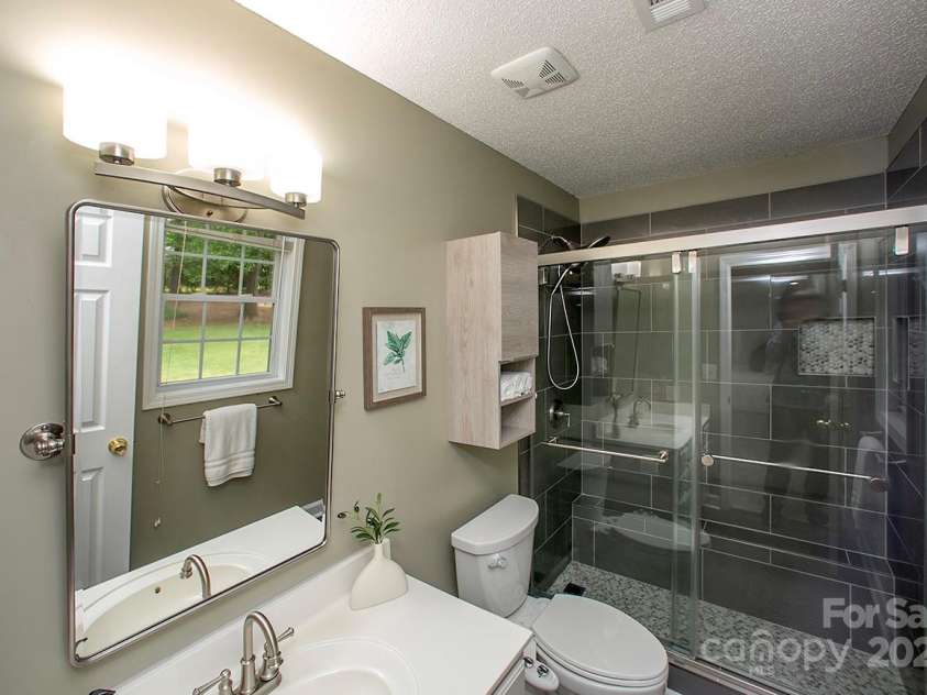1610 Ford Street, Charlotte, NC 28216.  MLS# CAR4257993, YatesRealty ID 14930. You'll love getting ready in the morning in your new owners' bathroom.