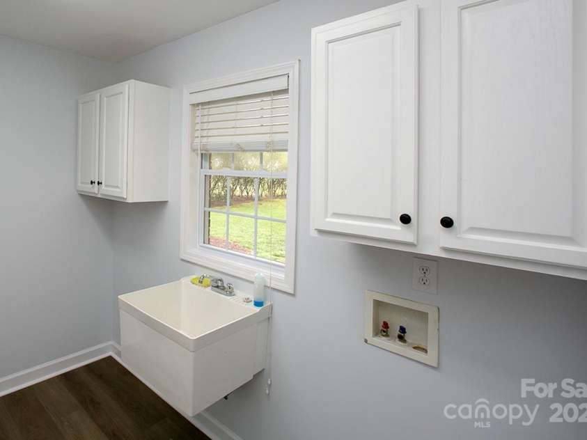 1610 Ford Street, Charlotte, NC 28216.  MLS# CAR4257993, YatesRealty ID 14930. You'll love your laundry on the main and mud room, complete with extra cabinets and wash sink.