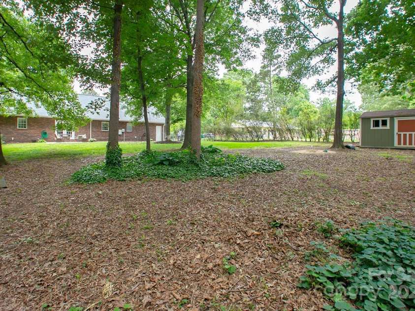 1610 Ford Street, Charlotte, NC 28216.  MLS# CAR4257993, YatesRealty ID 14930. Your .57-acre backyard is also fenced in so the kiddos and puppies will be safe.