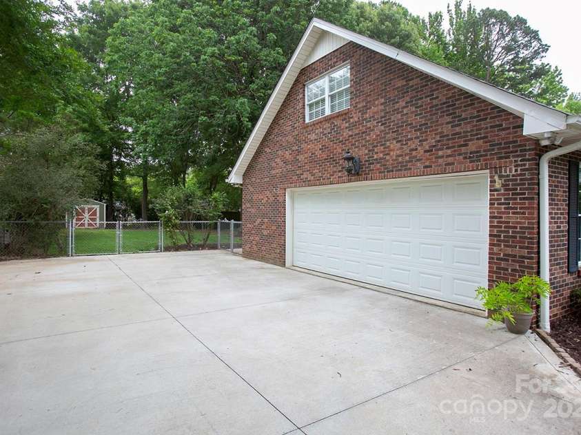 1610 Ford Street, Charlotte, NC 28216.  MLS# CAR4257993, YatesRealty ID 14930. Your new driveway is perfect for a basketball court. Yay.