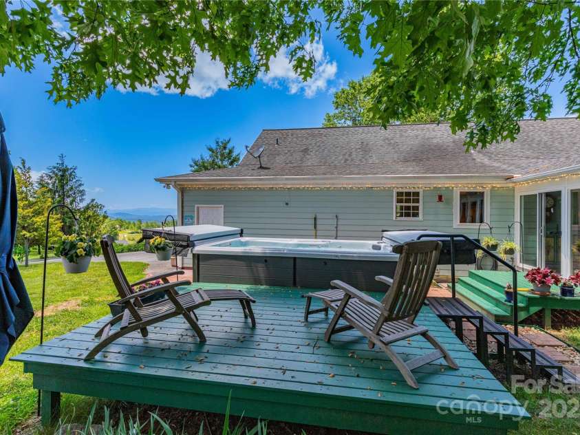 50 Appleola Road, Hendersonville, NC 28792.  MLS# CAR4262656, YatesRealty ID 14936. Back Deck with Swim Spa