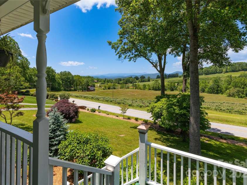 50 Appleola Road, Hendersonville, NC 28792.  MLS# CAR4262656, YatesRealty ID 14936. Views from Front Porch