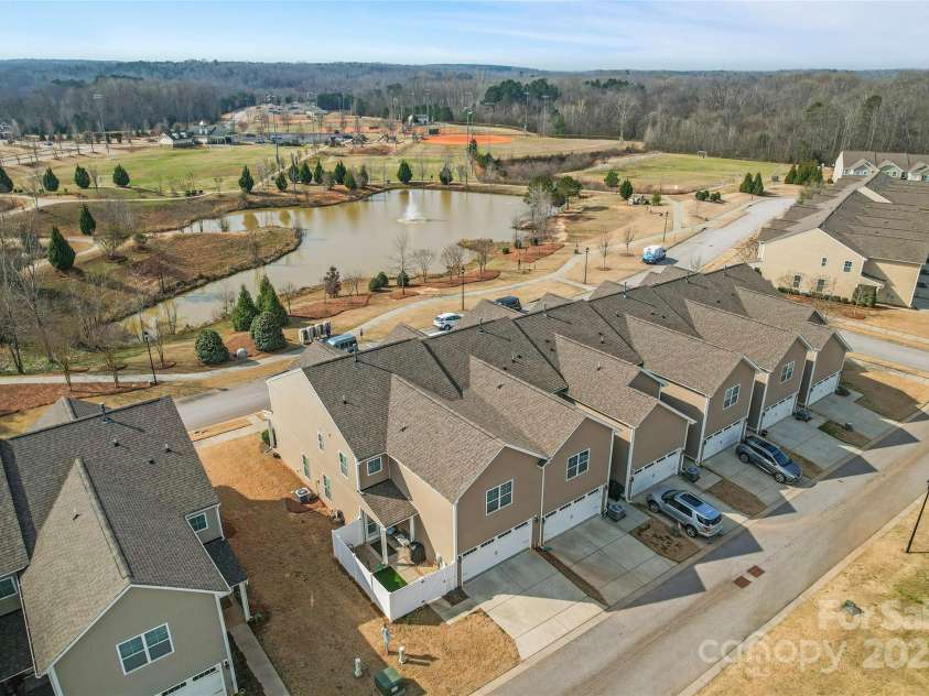 919 Pennington Drive, Lancaster, SC 29720.  MLS# CAR4228874, YatesRealty ID 14937. Pond view from the rear of the home | End unit | Fenced in Back Yard | 2 Car Garage
