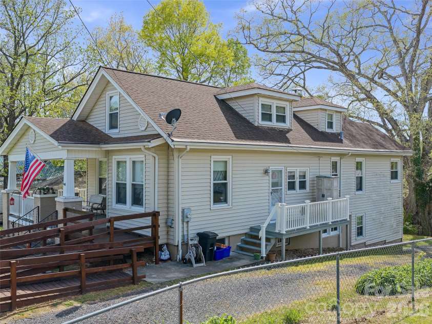 45 Summit Street, Burnsville, NC 28714.  MLS# CAR4372518, YatesRealty ID 14938. Side View of House with Additional Deck Entry