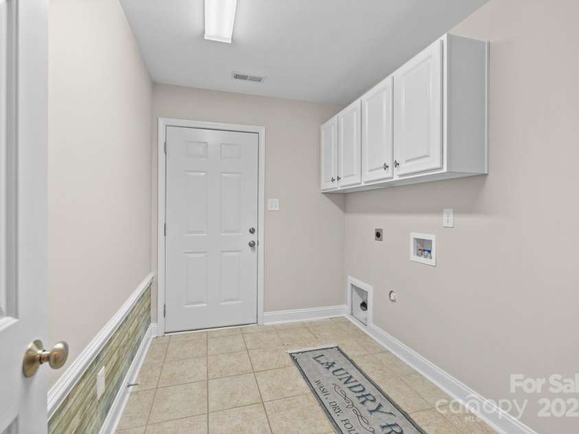 4405 Zee Court, Monroe, NC 28110.  MLS# CAR4224337, YatesRealty ID 14939. Full Laundry/Mud Room with built-in cabinets and hanging bar