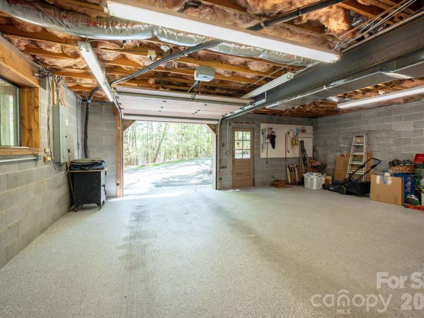 114 Timber Creek Road, Laurel Park, NC 28739.  MLS# CAR4371818, YatesRealty ID 14946. Basement Garage