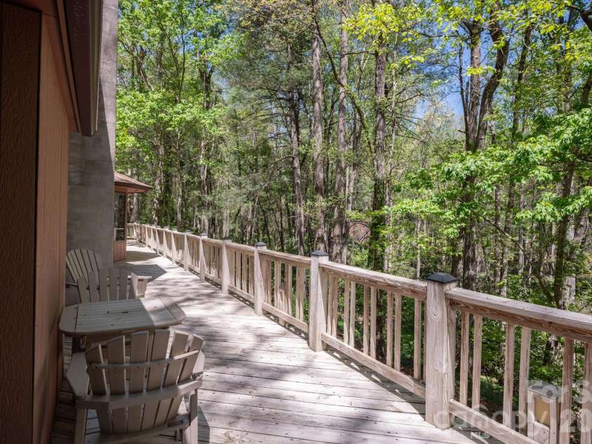 114 Timber Creek Road, Laurel Park, NC 28739.  MLS# CAR4371818, YatesRealty ID 14946. Deck Overlooks Lush Woods!